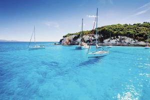 Book your Paxos and Antipaxos boat trip from Corfu today. Visit Blue Caves, swim in Antipaxos and enjoy stunning island views. Limited seats available with free transfer included.